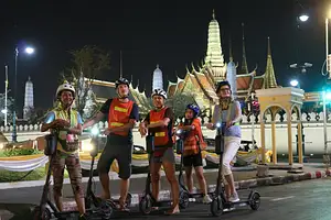Guided E-Scooter Night Tour with Local Street Food